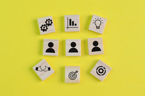 wooden-block-with-business-success-achievement-and-2022-11-02-16-33-56-utc