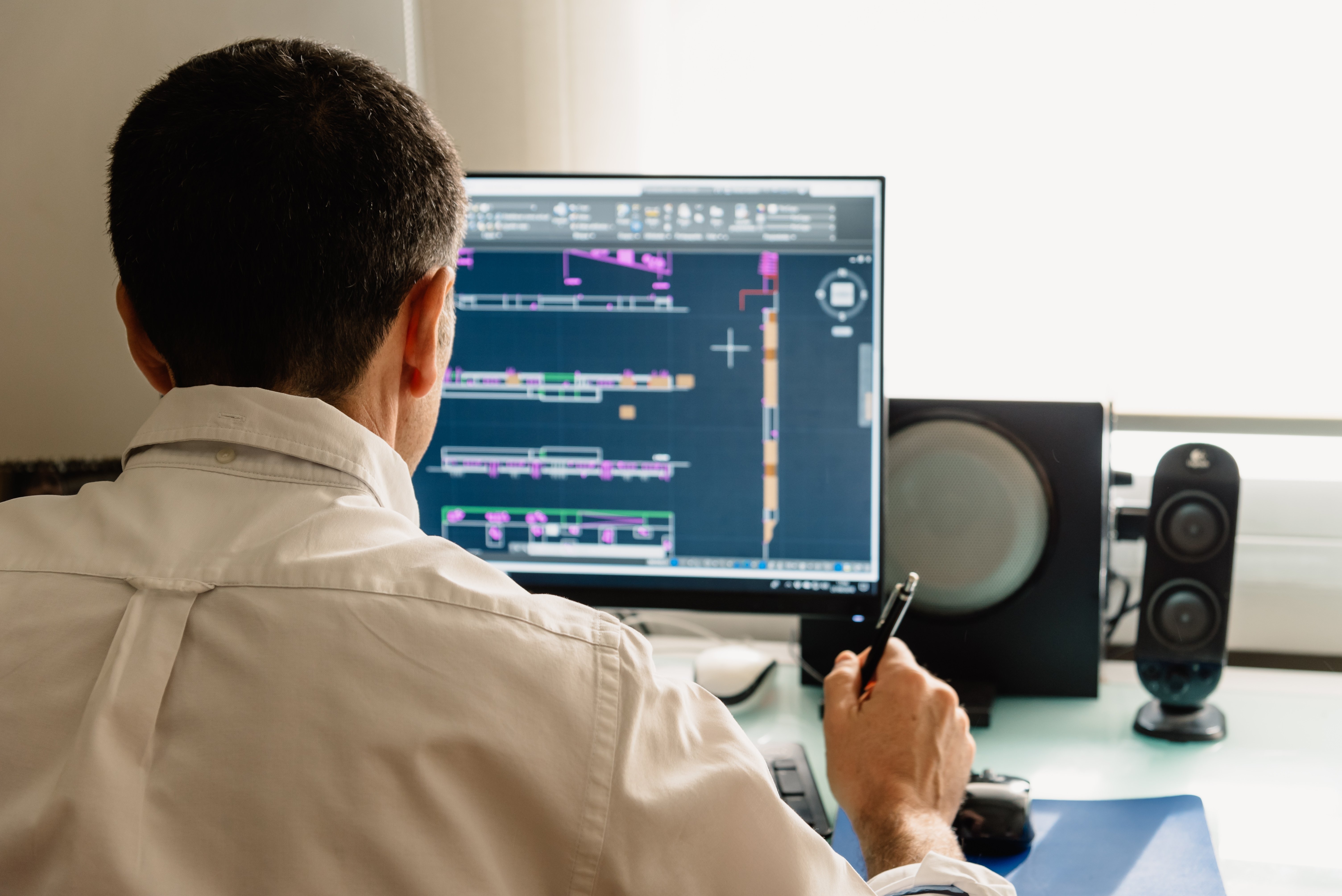 architect-drawing-with-cad-software-designing-buil-2021-09-01-10-33-42-utc