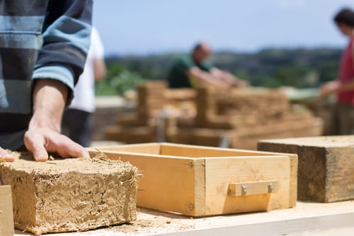 clay-brick-mould-in-the-hands-of-a-worker-alterna-2023-11-27-05-16-22-utc