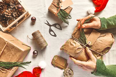 woman-s-hands-holding-christmas-gift-wrapped-in-cr-2022-09-15-01-12-52-utc